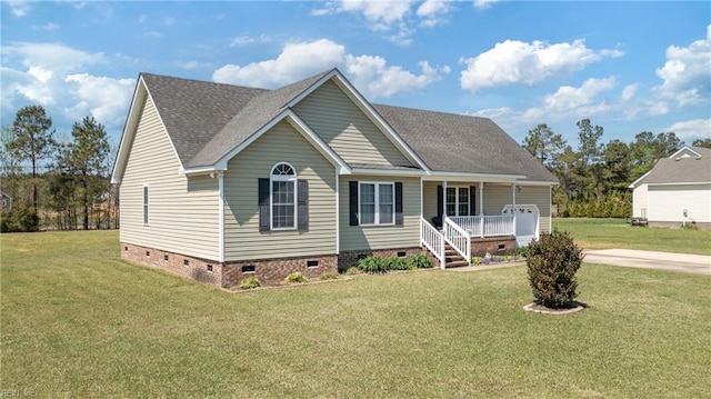 view of front of property with a shingled roof, a porch, a front lawn, and crawl space