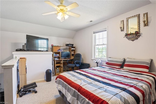 bedroom featuring carpet floors, a textured ceiling, a ceiling fan, vaulted ceiling, and visible vents