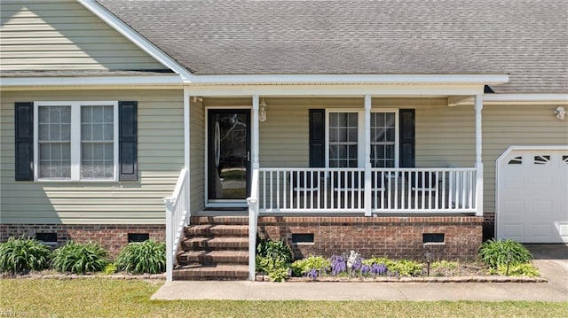 doorway to property featuring roof with shingles, an attached garage, a porch, and crawl space