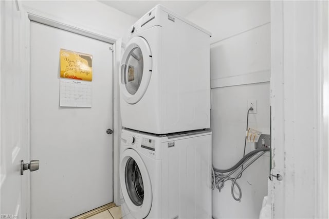 laundry area featuring laundry area and stacked washer / drying machine