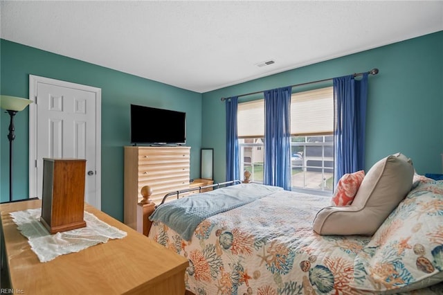 bedroom featuring visible vents