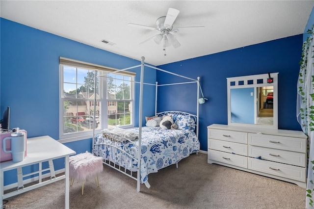 carpeted bedroom featuring visible vents and ceiling fan