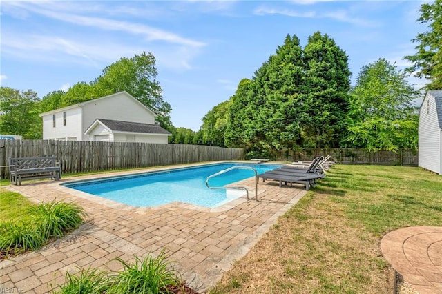 view of swimming pool with a lawn, a fenced in pool, a fenced backyard, and a patio area