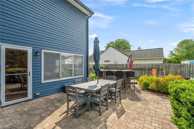 view of patio / terrace featuring fence and outdoor dining space