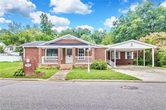 913 Garfield Ave, Suffolk, VA 23434 - view of front facade with a porch, a front yard, brick siding, and concrete driveway