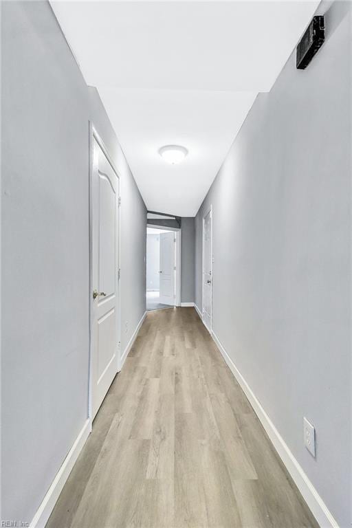 913 Garfield Ave, Suffolk, VA 23434 - hallway with baseboards and light wood-style floors