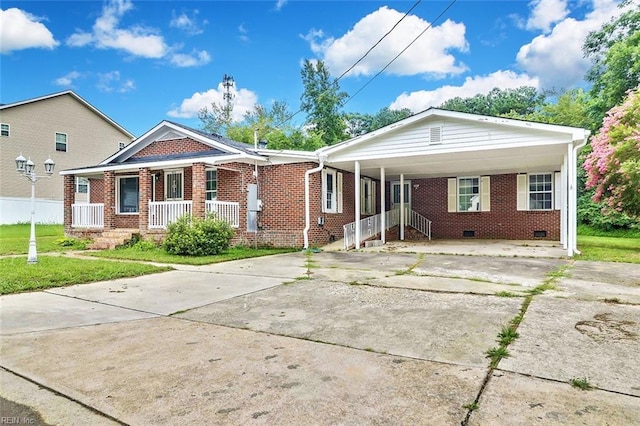 913 Garfield Ave, Suffolk, VA 23434 - view of front of house with a front lawn, brick siding, an attached carport, a porch, and concrete driveway