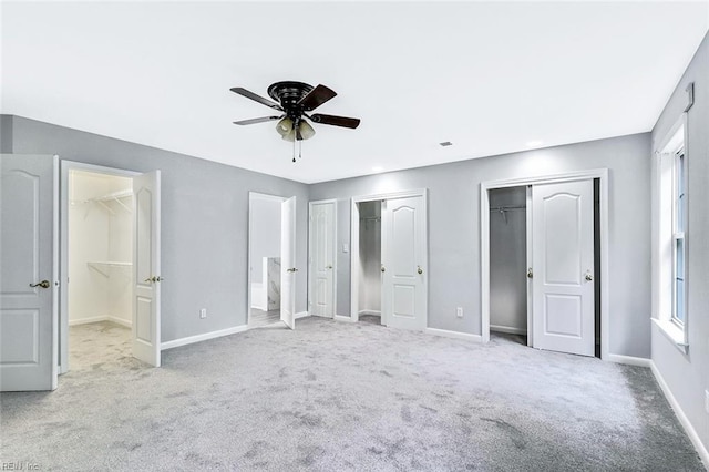 913 Garfield Ave, Suffolk, VA 23434 - unfurnished bedroom with carpet flooring, baseboards, ceiling fan, and two closets