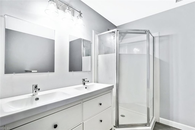 913 Garfield Ave, Suffolk, VA 23434 - full bath with double vanity, a sink, and a stall shower