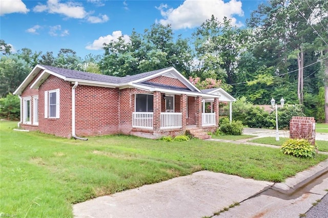 913 Garfield Ave, Suffolk, VA 23434 - view of side of home featuring brick siding, a lawn, and covered porch