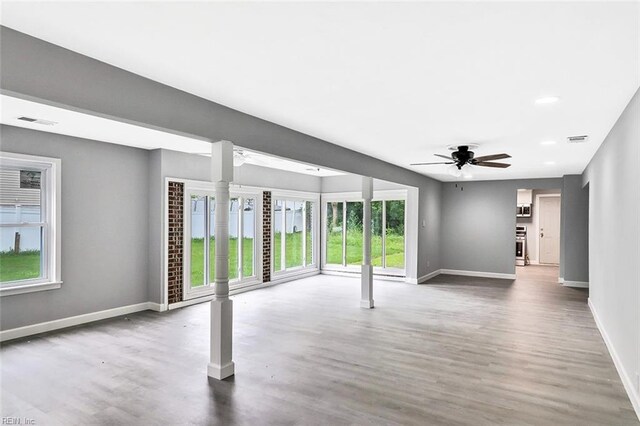 913 Garfield Ave, Suffolk, VA 23434 - unfurnished living room with baseboards, ceiling fan, wood finished floors, and visible vents