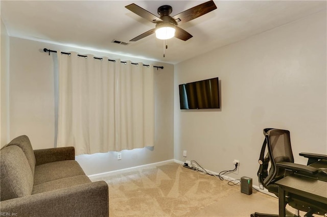living area featuring baseboards, a ceiling fan, carpet, and visible vents