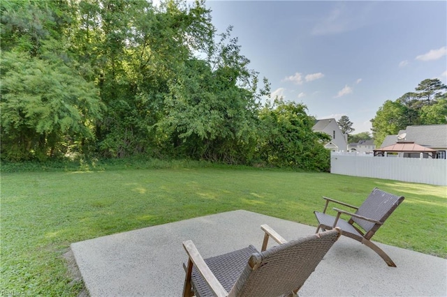 view of yard featuring fence and a patio area