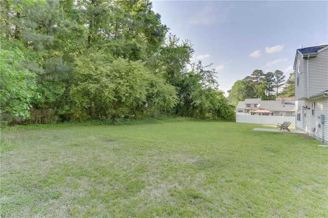 view of yard featuring a patio area and fence