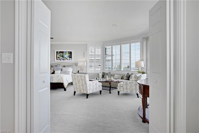 bedroom featuring crown molding, baseboards, and carpet flooring