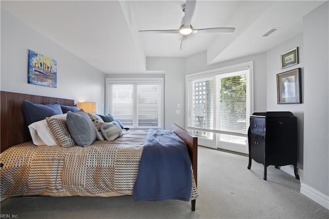 carpeted bedroom with visible vents, a ceiling fan, baseboards, and access to exterior