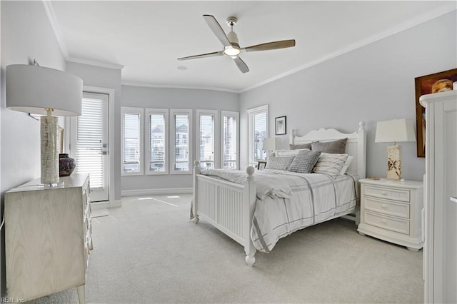 bedroom with crown molding, a ceiling fan, baseboards, and light carpet