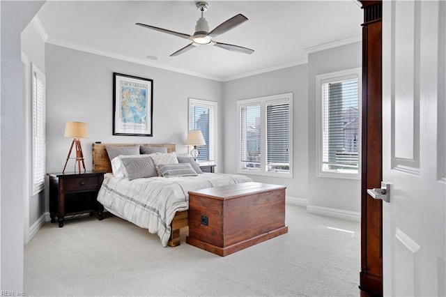 bedroom featuring baseboards, multiple windows, and light carpet
