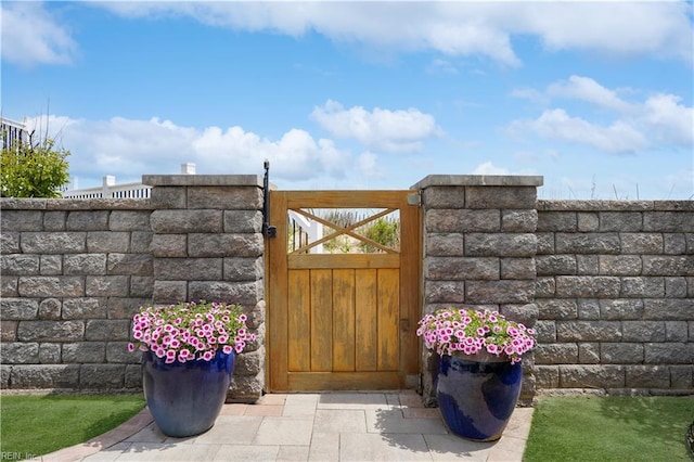 view of gate featuring fence