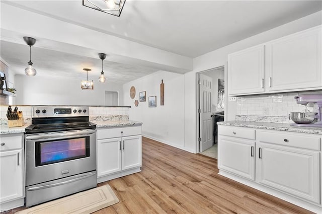 kitchen with backsplash, white cabinetry, and stainless steel electric range