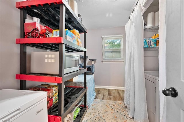 storage room featuring washer / dryer