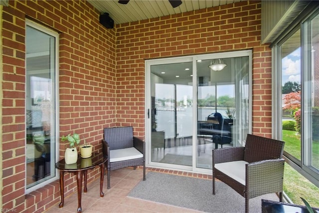 view of patio featuring ceiling fan