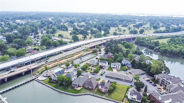birds eye view of property with a water view and a residential view