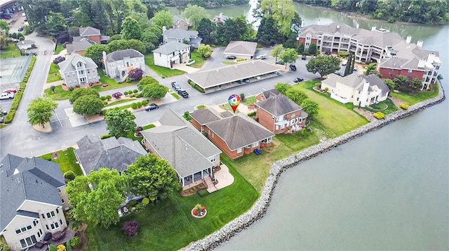 bird's eye view featuring a water view and a residential view