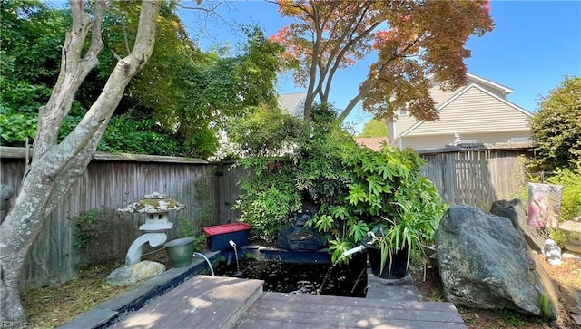 exterior space featuring a fenced backyard