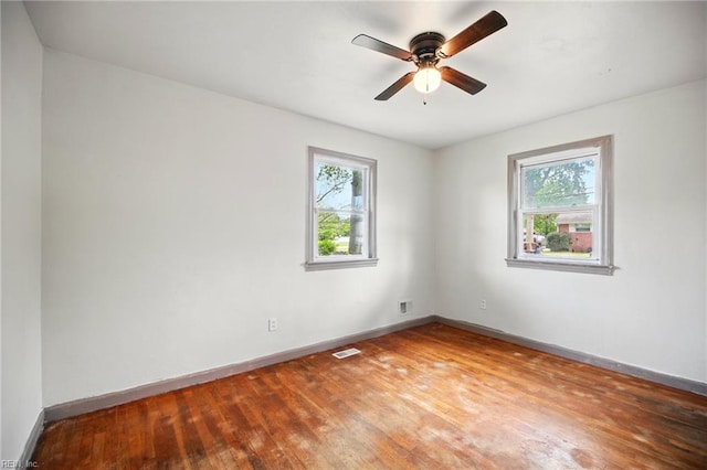 1 Polaris St, Hampton, VA 23669 - unfurnished room with baseboards, plenty of natural light, wood finished floors, and visible vents