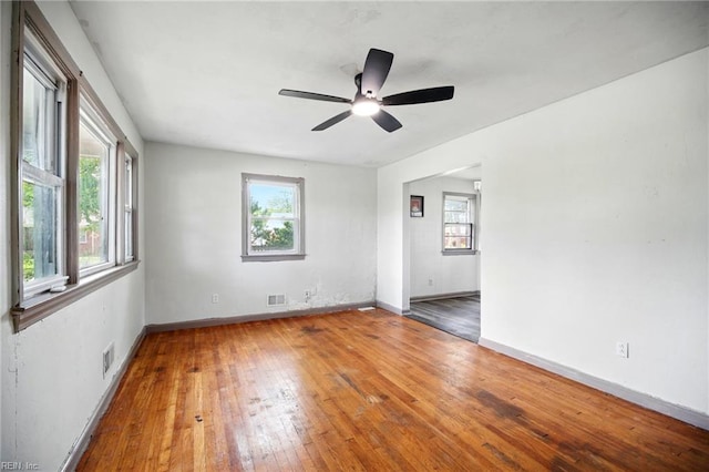 1 Polaris St, Hampton, VA 23669 - empty room featuring visible vents, a healthy amount of sunlight, and hardwood / wood-style floors