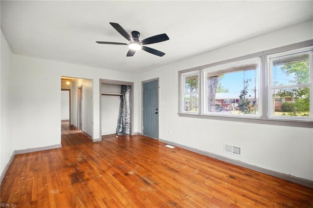 1 Polaris St, Hampton, VA 23669 - unfurnished bedroom featuring baseboards, wood-type flooring, a closet, and visible vents