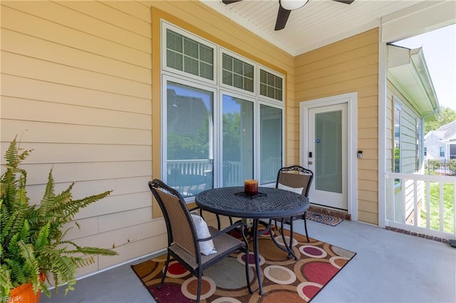 view of patio featuring a ceiling fan and outdoor dining space