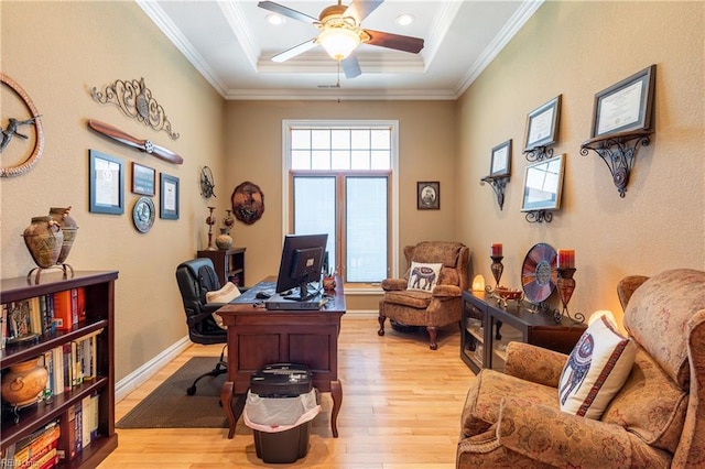 office area featuring light wood-style floors, ceiling fan, and ornamental molding