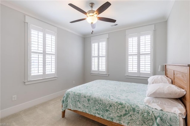 bedroom featuring visible vents, ornamental molding, baseboards, and carpet floors