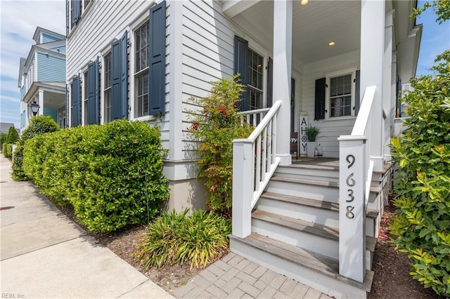 view of side of home with a porch