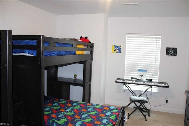 bedroom with visible vents, baseboards, and carpet floors