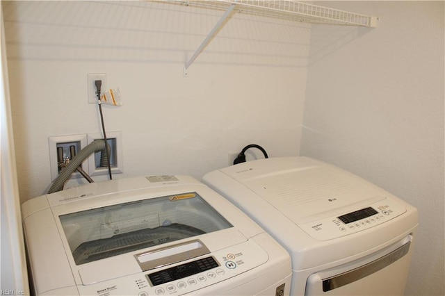 clothes washing area featuring laundry area and independent washer and dryer