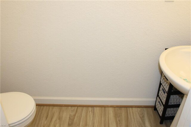 2552 Fieldsway Dr, Chesapeake, VA 23320 - bathroom featuring a sink, baseboards, toilet, and wood finished floors
