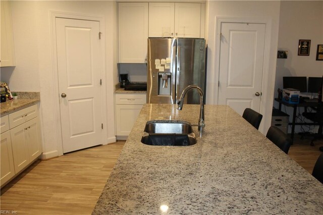 2552 Fieldsway Dr, Chesapeake, VA 23320 - kitchen featuring stainless steel refrigerator with ice dispenser, white cabinetry, a sink, and light wood-style floors