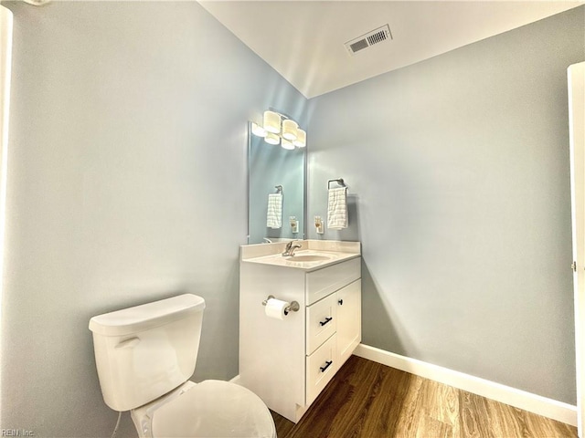 107 Mill Creek Rd, Edenton, NC 27932 - bathroom with baseboards, wood finished floors, vanity, and toilet