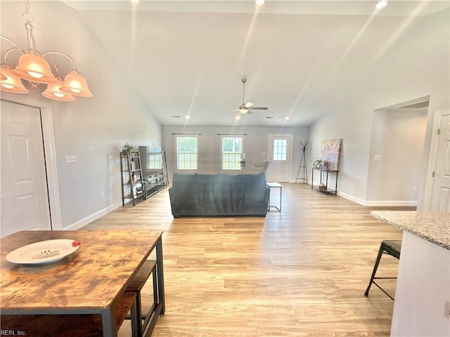 107 Mill Creek Rd, Edenton, NC 27932 - living room with baseboards, a ceiling fan, light wood-type flooring, vaulted ceiling, and a chandelier