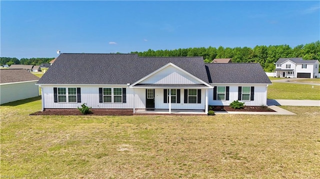 107 Mill Creek Rd, Edenton, NC 27932 - view of front of home featuring a front yard, covered porch, roof with shingles, and board and batten siding