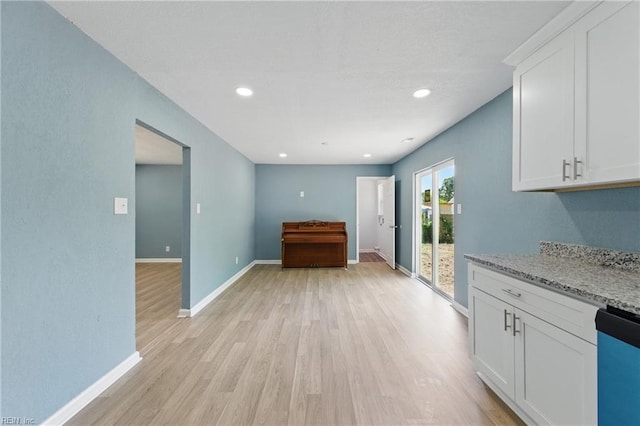 725 Burgesses Ln, Virginia Beach, VA 23452 - kitchen featuring white cabinets, light stone counters, baseboards, light wood-type flooring, and dishwashing machine