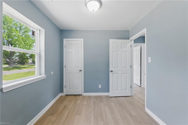 725 Burgesses Ln, Virginia Beach, VA 23452 - unfurnished bedroom featuring baseboards and light wood-type flooring