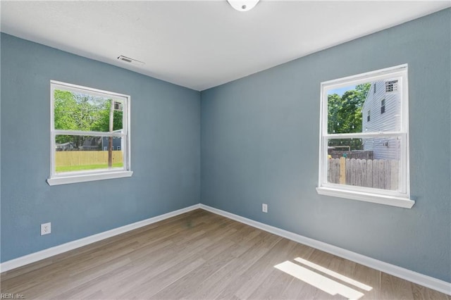 725 Burgesses Ln, Virginia Beach, VA 23452 - unfurnished room with baseboards, wood finished floors, and visible vents