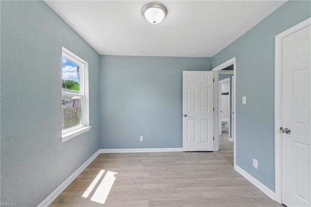 725 Burgesses Ln, Virginia Beach, VA 23452 - unfurnished bedroom featuring baseboards and light wood-style flooring