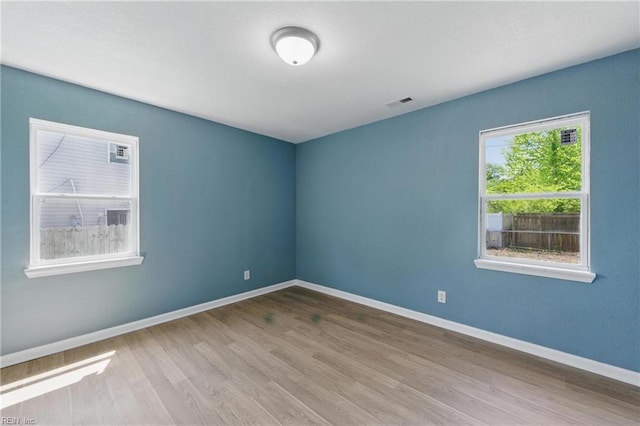 725 Burgesses Ln, Virginia Beach, VA 23452 - spare room featuring baseboards, wood finished floors, and visible vents
