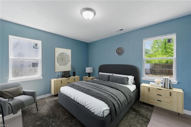 725 Burgesses Ln, Virginia Beach, VA 23452 - bedroom with baseboards, wood finished floors, and visible vents