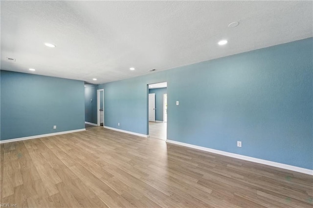 725 Burgesses Ln, Virginia Beach, VA 23452 - empty room with recessed lighting, a textured ceiling, light wood finished floors, and baseboards